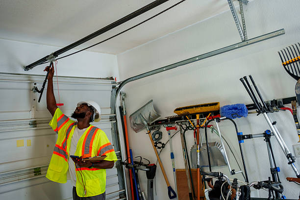 Professional Garage Door Panel Replacement technician working in North Syracuse, NY
